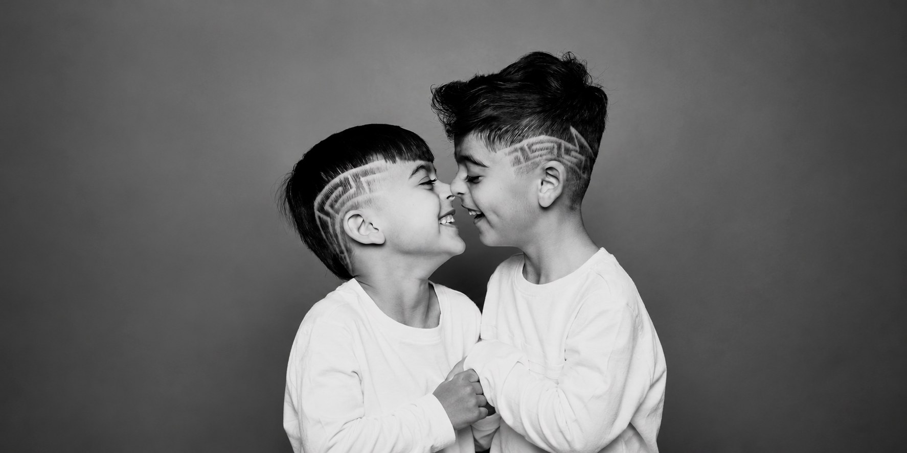 Sam's sons with detailed geometric hair designs at Fade Style Barber