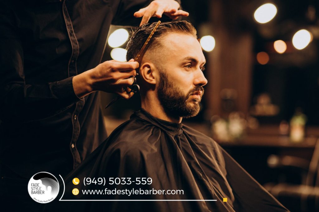 Client getting a modern fade haircut at one of the best barber shops of Capistrano Beach