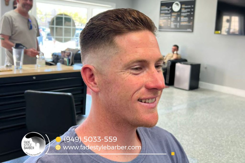 Man with a perfectly groomed skin fade hairstyle, highlighting the fade details.